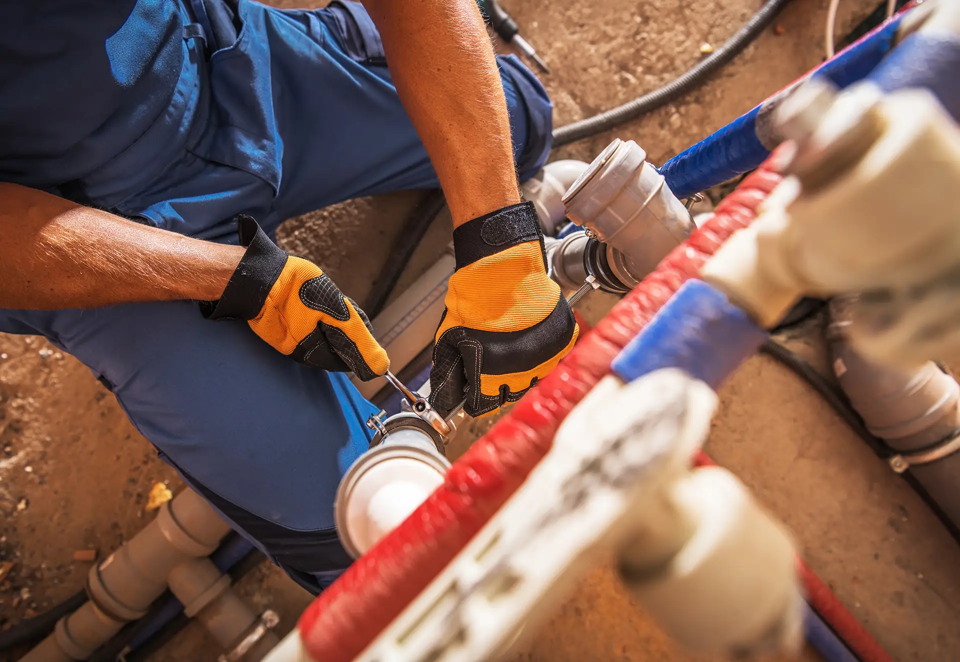 Plumber doing pipe repair on a water line