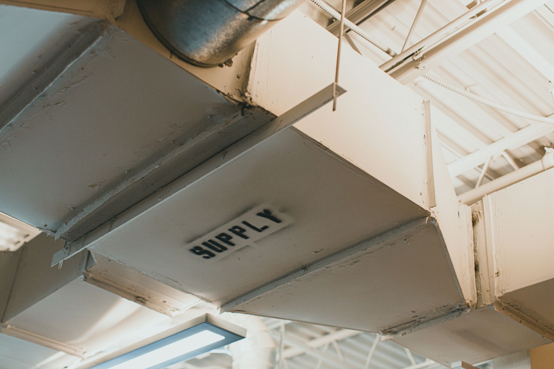Close-up of an apartment building air duct before an air duct cleaning service
