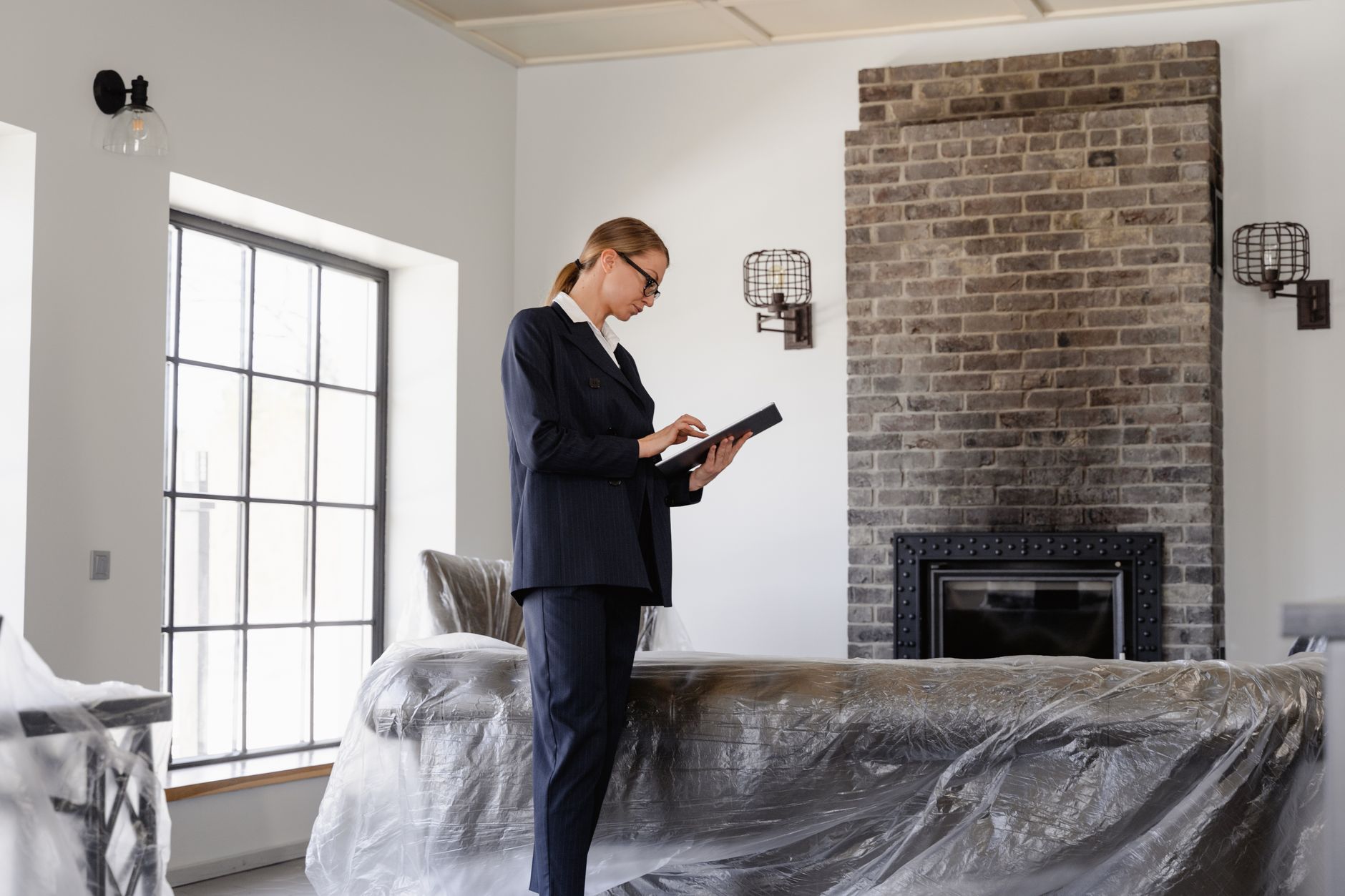 Property manager using property maintenance technology on a tablet to inspect a vacant apartment